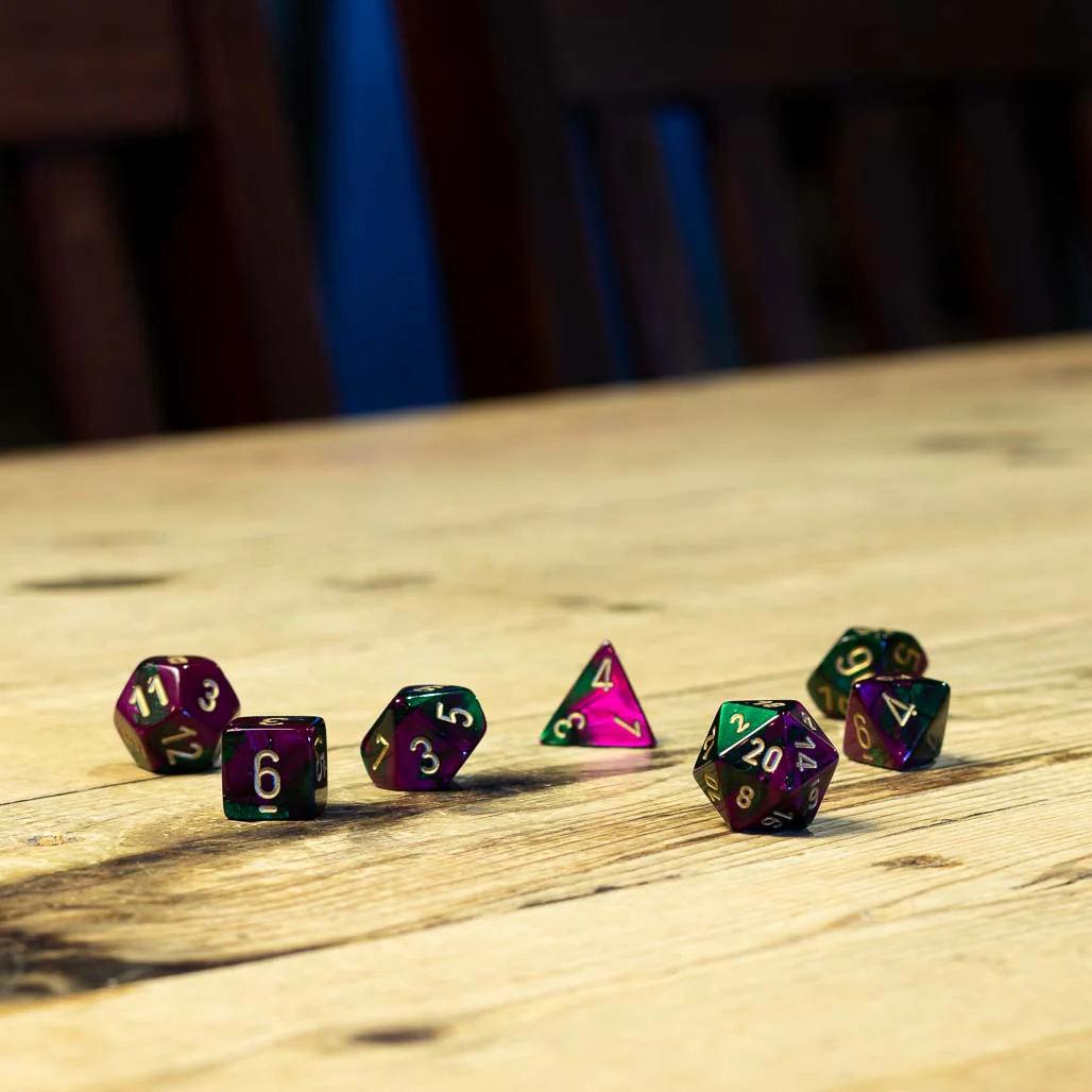 Chessex #26434 - Gemini Green-Purple / Gold Polyhedral (7ct)